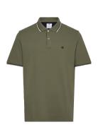 Polo Tops Polos Short-sleeved Green Champion
